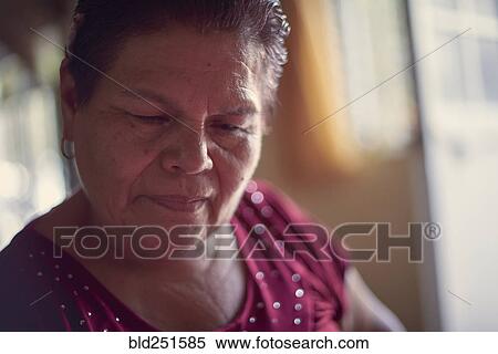 Hispanic woman looking down View Large Photo Image Stock Photography - Hispanic woman looking down. Fotosearch