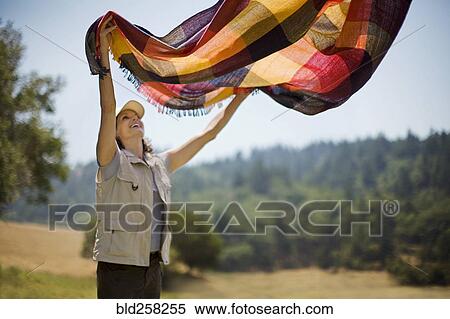 Hispanic woman s1eading picnic blanket outdoors View Large Photo Image Stock Photography - Hispanic woman s1eading picnic blanket outdoors. Fotosearch