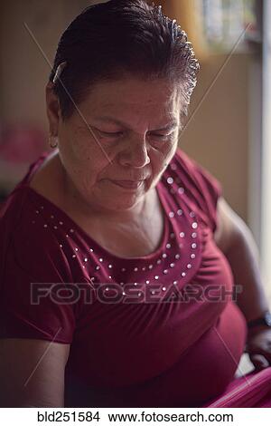 Hispanic woman weaving fabric on loom View Large Photo Image Picture - Hispanic woman weaving fabric on loom. Fotosearch