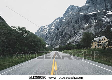 House near empty road in mountain landscape View Large Photo Image Stock Image - House near empty road in mountain landscape. Fotosearch