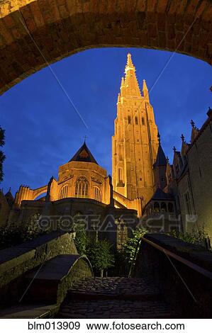 Stock Photo - Illuminated bell tower on cathedral. Fotosearch