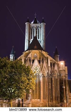 Stock Photo - Illuminated cathedral and bell tower. Fotosearch