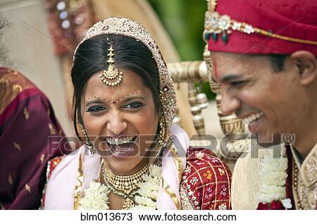 Stock Image - Indian bride and groom in traditional clothing. Fotosearch