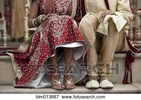 Indian bride and groom in traditional clothing View Large Photo Image Stock Photo - Indian bride and groom in traditional clothing. Fotosearch