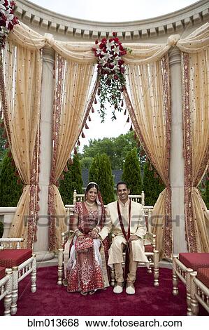 Indian bride and groom in traditional clothing View Large Photo Image Stock Photo - Indian bride and groom in traditional clothing. Fotosearch