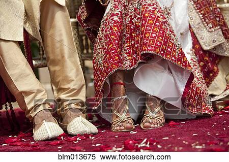 Stock Photography - Indian bride and groom in traditional clothing. Fotosearch