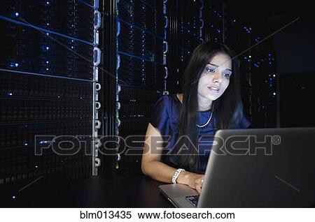 Stock Photography - Indian businesswoman working in server room. Fotosearch