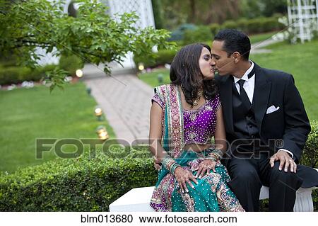 Indian couple in traditional clothing kissing View Large Photo Image Stock Image - Indian couple in traditional clothing kissing. Fotosearch