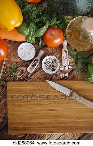 Ingredients for salad near cutting board View Large Photo Image Picture - Ingredients for salad near cutting board. Fotosearch
