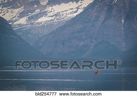 Stock Photo - Kayak in mountain lake. Fotosearch