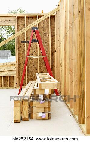 Picture - Ladder and wooden frame at construction site. Fotosearch
