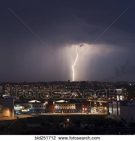 Lightning strike in city at night View Large Photo Image Stock Image - Lightning strike in city at night. Fotosearch