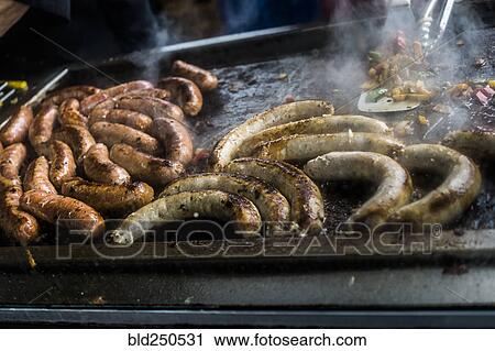 Links of meat cooking on grille View Large Photo Image Stock Image - Links of meat cooking on grille. Fotosearch