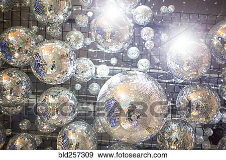 Stock Photo - Low angle view of disco balls on ceiling. Fotosearch
