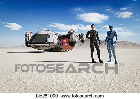 Stock Image - Man and robot in desert with futuristic vehicle. Fotosearch
