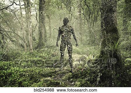 Man covered with rocks in forest View Large Photo Image Stock Photo - Man covered with rocks in forest. Fotosearch