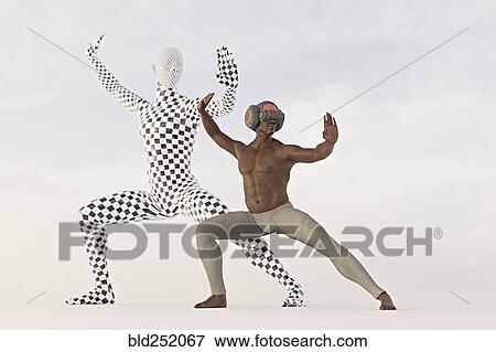 Stock Photo - Man wearing virtual reality goggles performing martial arts. Fotosearch