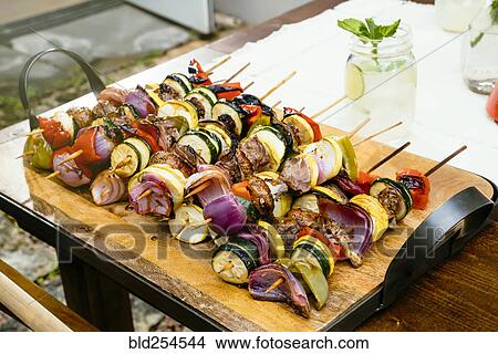 Picture - Meat and vegetables on skewers. Fotosearch