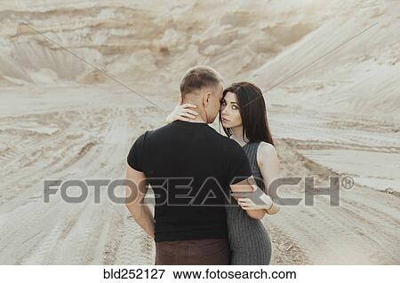 Middle Eastern couple hugging in desert View Large Photo Image Stock Photo - Middle Eastern couple hugging in desert. Fotosearch