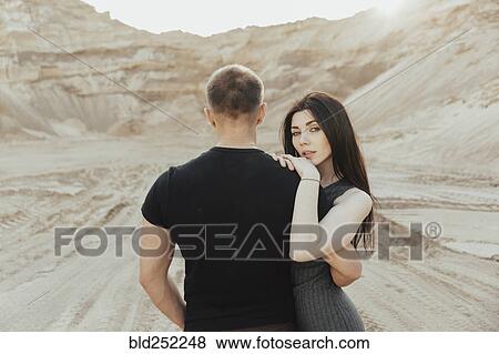Middle Eastern couple hugging in the desert View Large Photo Image Stock Photo - Middle Eastern couple hugging in the desert. Fotosearch