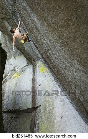 Mixed race boy rock climbing View Large Photo Image Stock Photography - Mixed race boy rock climbing. Fotosearch