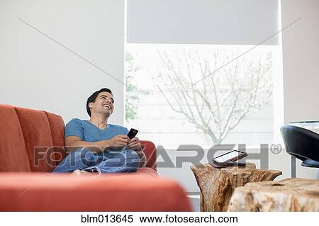 Mixed race man text messaging on cell phone View Large Photo Image Stock Photography - Mixed race man text messaging on cell phone. Fotosearch
