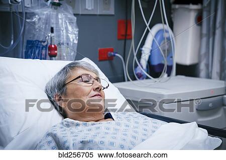 Mixed race patient in hospital bed View Large Photo Image Stock Photography - Mixed race patient in hospital bed. Fotosearch