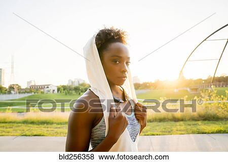 Mixed race woman resting with towel on head View Large Photo Image Stock Photo - Mixed race woman resting with towel on head. Fotosearch