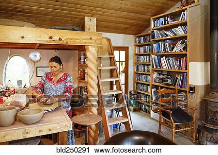 Mixed race woman shaping clay in art studio View Large Photo Image Stock Image - Mixed race woman shaping clay in art studio. Fotosearch