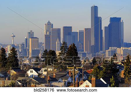 Modern highrises behind houses View Large Photo Image Stock Photograph - Modern highrises behind houses. Fotosearch