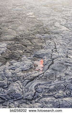 Molten lava glowing near dried lava View Large Photo Image Stock Image - Molten lava glowing near dried lava. Fotosearch