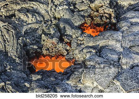 Molten lava glowing near dried lava View Large Photo Image Stock Photography - Molten lava glowing near dried lava. Fotosearch