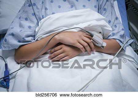 Monitor on finger of Caucasian girl in hospital View Large Photo Image Stock Photograph - Monitor on finger of Caucasian girl in hospital. Fotosearch