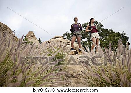 Stock Image - Mother and daughter hiking together. Fotosearch