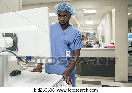 Nurse using a computer View Large Photo Image Stock Photo - Nurse using a computer. Fotosearch