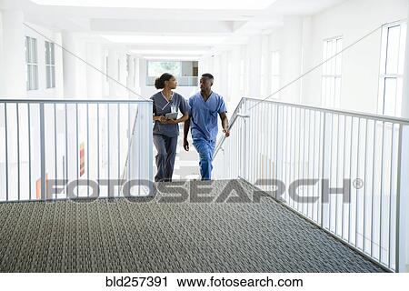 Nurses climbing staircase View Large Photo Image Stock Image - Nurses climbing staircase. Fotosearch