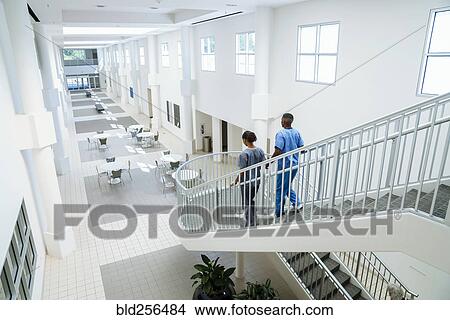 Nurses descending staircase View Large Photo Image Picture - Nurses descending staircase. Fotosearch