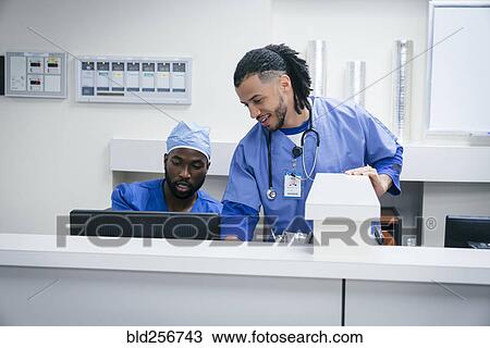 Nurses using computer in hospital View Large Photo Image Stock Image - Nurses using computer in hospital. Fotosearch