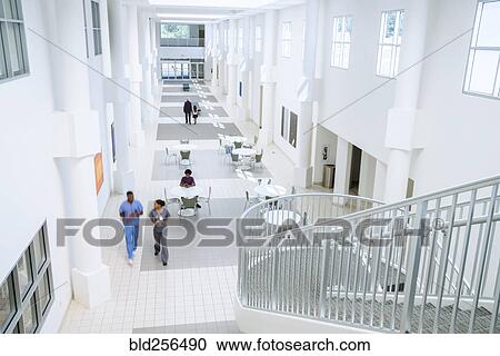 Nurses walking in lobby View Large Photo Image Stock Image - Nurses walking in lobby. Fotosearch