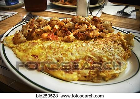 Omelet on plate with hash browns View Large Photo Image Stock Photo - Omelet on plate with hash browns . Fotosearch