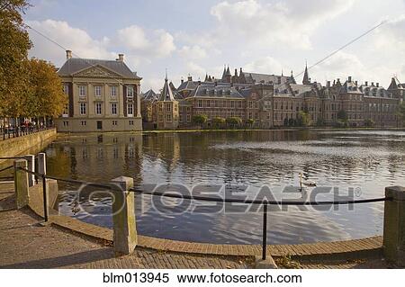Ornate Dutch buildings near pond View Large Photo Image Stock Photography - Ornate Dutch buildings near pond. Fotosearch