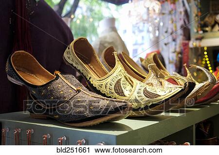 Stock Image - Ornate shoes on shelf. Fotosearch