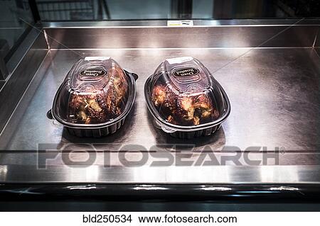 Picture - Oven roasted chicken in warmer. Fotosearch