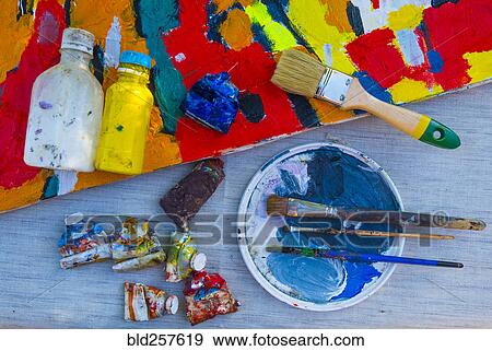 Painting supplies on table with canvas View Large Photo Image Stock Photo - Painting supplies on table with canvas. Fotosearch