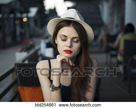 Pensive Caucasian woman at sidewalk cafe View Large Photo Image Stock Image - Pensive Caucasian woman at sidewalk cafe. Fotosearch
