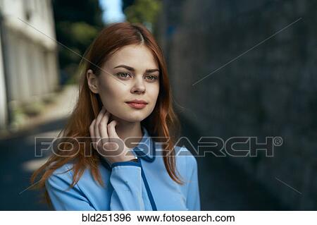 Pensive Caucasian woman near stone wall View Large Photo Image Stock Photograph - Pensive Caucasian woman near stone wall. Fotosearch