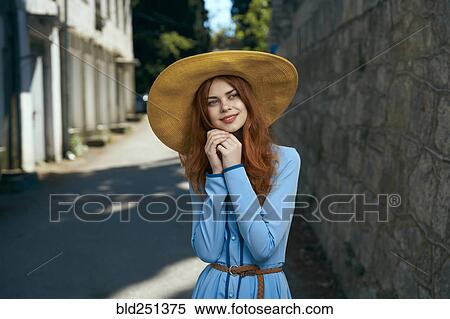 Pensive Caucasian woman wearing hat near stone wall View Large Photo Image Stock Photography - Pensive Caucasian woman wearing hat near stone wall. Fotosearch