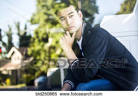 Pensive Chinese man sitting View Large Photo Image Stock Photography - Pensive Chinese man sitting. Fotosearch