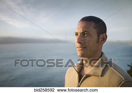 Pensive mixed race man near bay View Large Photo Image Stock Image - Pensive mixed race man near bay. Fotosearch