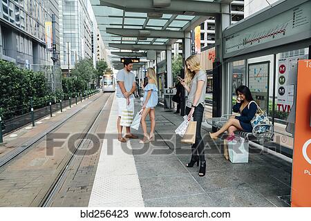 People at train station using cell phones View Large Photo Image Stock Image - People at train station using cell phones. Fotosearch